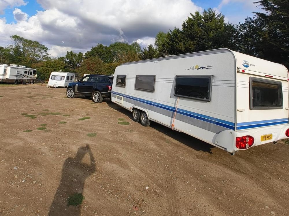 Caravan being towed behind a Range Rover